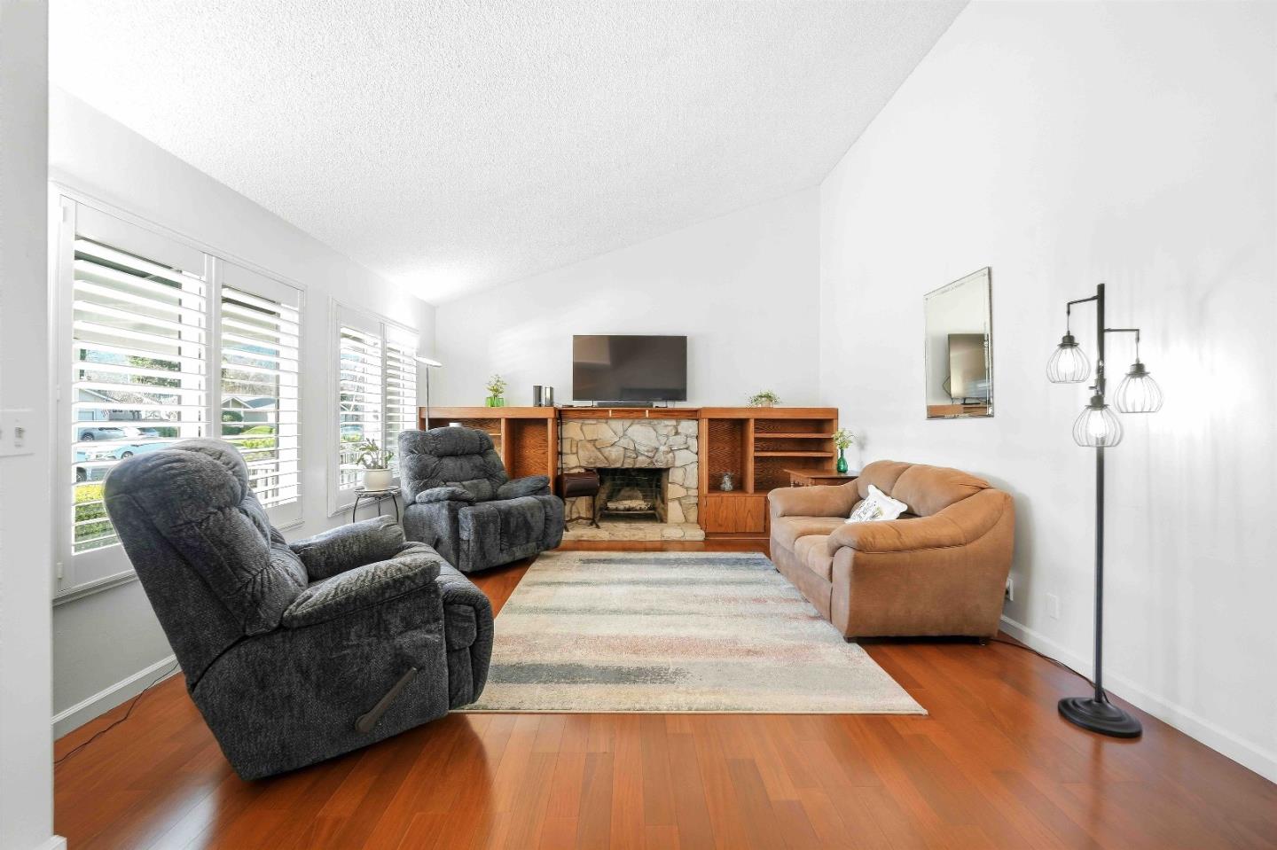 925 Blake Court Gilroy, CA 95020 - Photo 6 of 30 a living room with furniture and a fireplace
