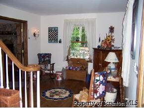 6 Callapoose Road Sterling, PA 18463 - Photo 2 of 6 a picture of a living room with a fireplace