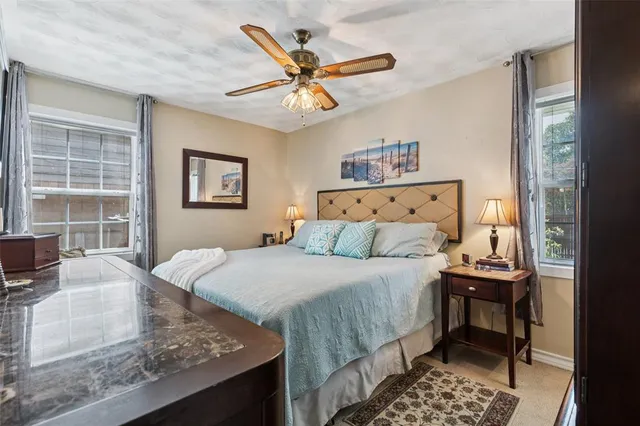 a bedroom with a bed and window