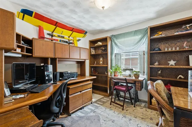 a living room with furniture a rug and a fireplace