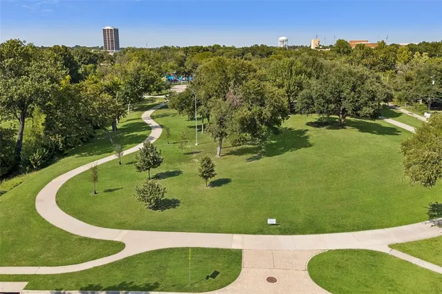 a view of a swimming pool with a yard