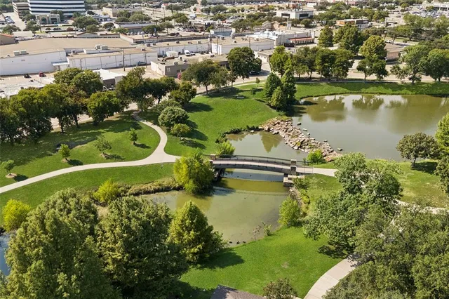 an aerial view of a house with a lake view