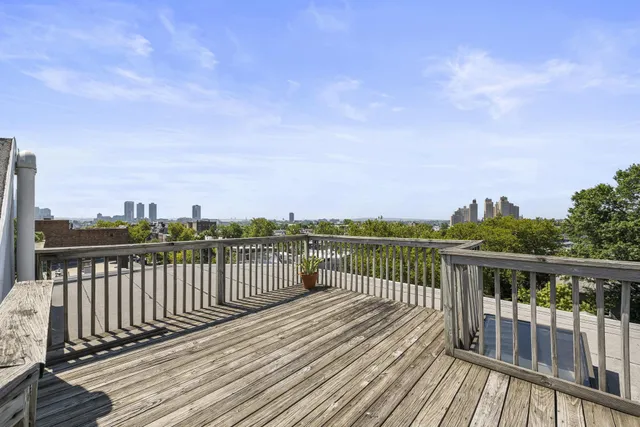 a view of a balcony with wooden floor