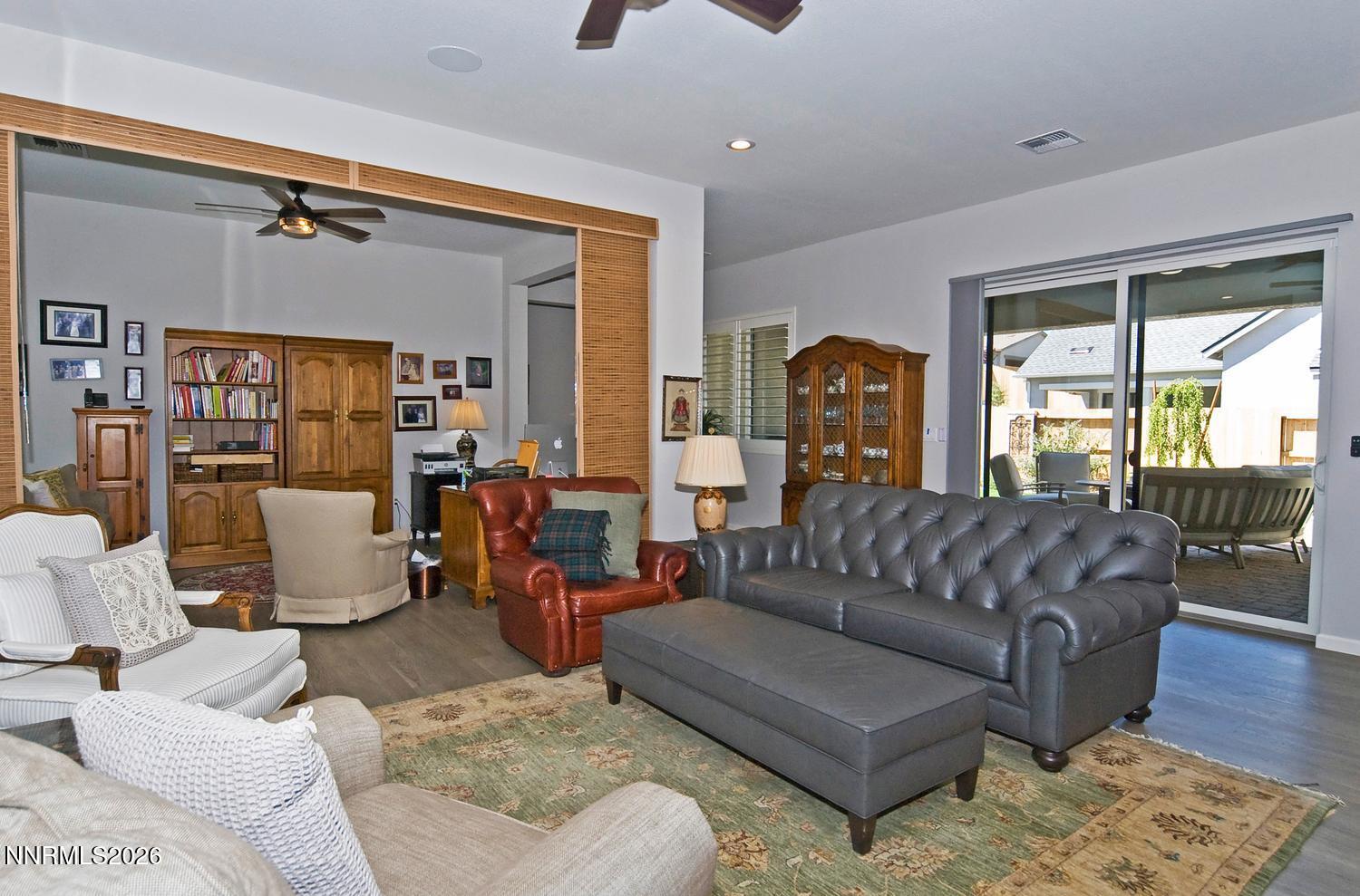 2332 Hammer Falls Drive Reno, NV 89521 - Photo 11 of 57 a living room with furniture and a large window