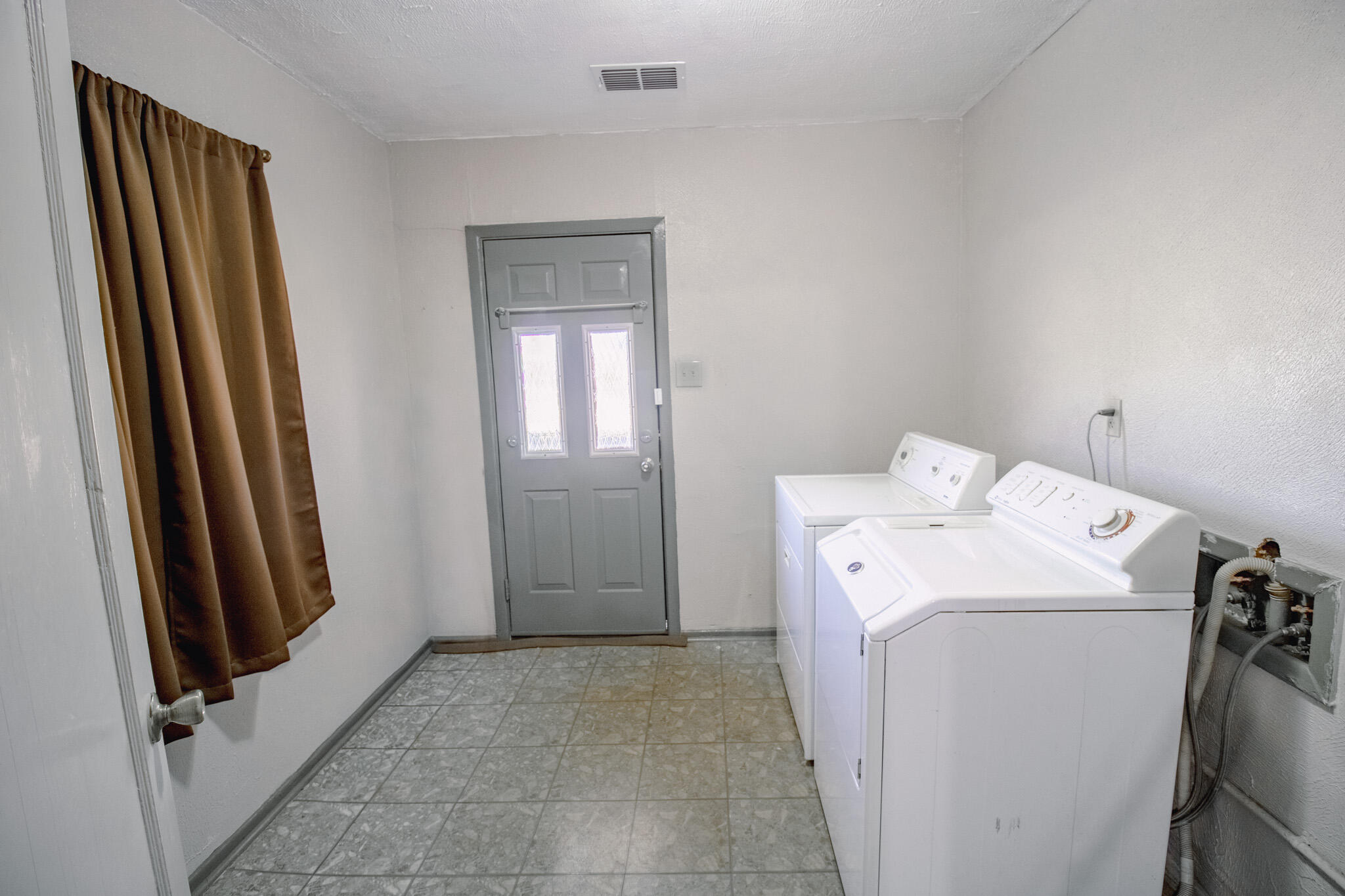 3114 Baylor Street Lubbock, TX 79415 - Photo 11 of 11 a utility room with dryer and washer