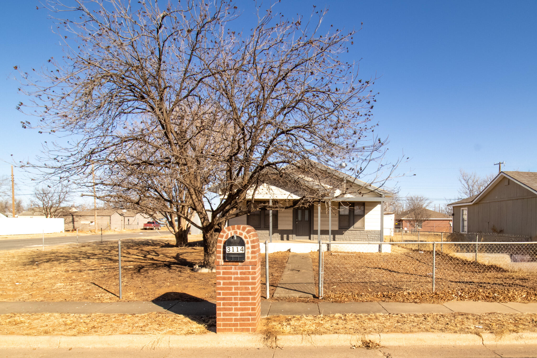 3114 Baylor Street Lubbock, TX 79415 - Photo 2 of 11 a view of a yard covered with snow