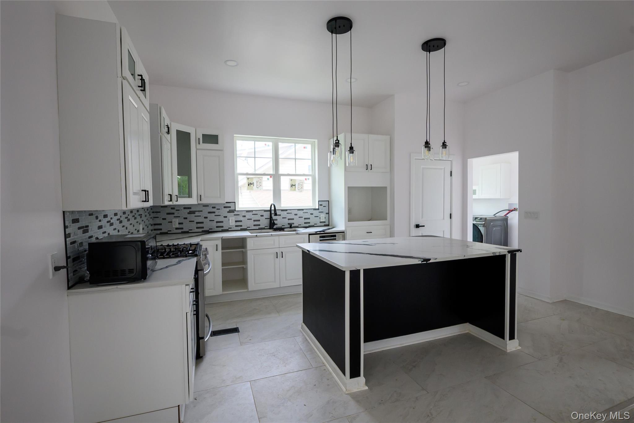 81 Silver Lake Sctn Road Middletown, NY 10940 - Photo 12 of 37 a kitchen with a sink stove and cabinets