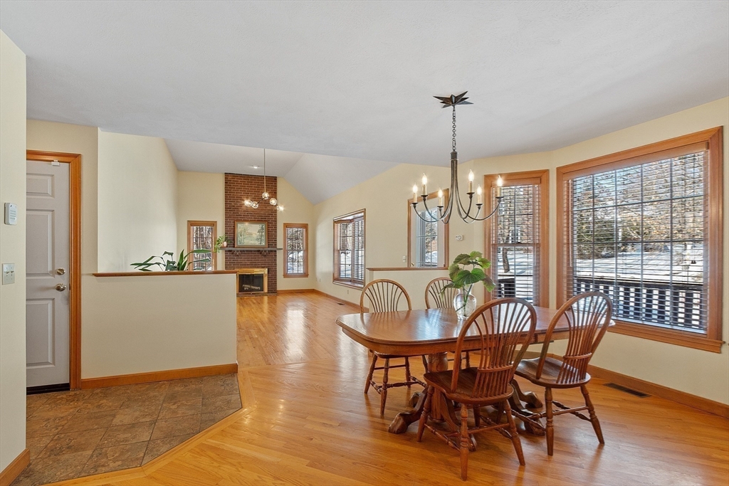 220 Hayden Road Groton, MA 01450 - Photo 13 of 37 a view of a dining room with furniture window and wooden floor