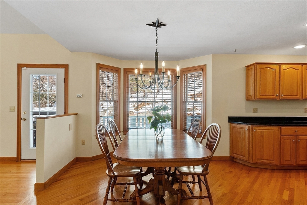 220 Hayden Road Groton, MA 01450 - Photo 15 of 37 a view of a dining room with furniture window and wooden floor