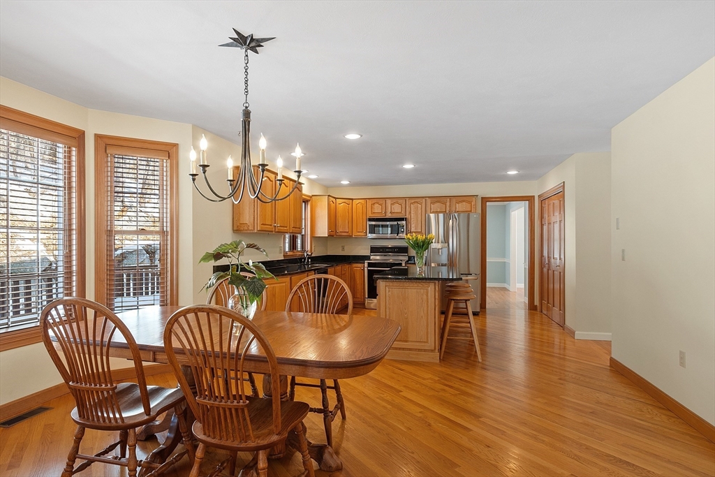 220 Hayden Road Groton, MA 01450 - Photo 16 of 37 a view of a dining room with furniture window and wooden floor