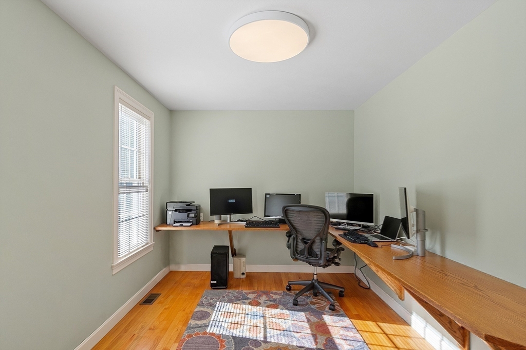 220 Hayden Road Groton, MA 01450 - Photo 19 of 37 a view of a workspace with furniture and a window