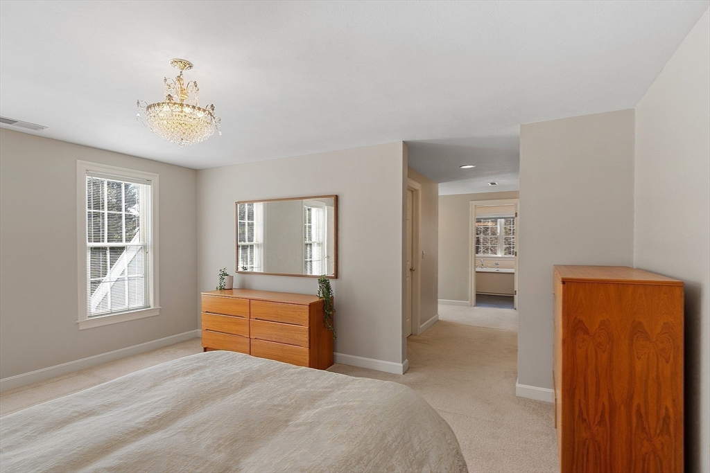 220 Hayden Road Groton, MA 01450 - Photo 23 of 37 a bedroom with a bed and a window