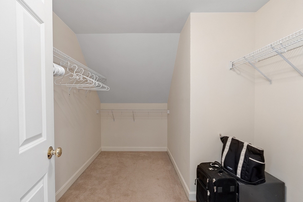 220 Hayden Road Groton, MA 01450 - Photo 28 of 37 a view of storage and utility room with empty racks