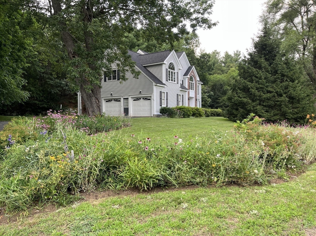 220 Hayden Road Groton, MA 01450 - Photo 4 of 37 a front view of house with yard and green space