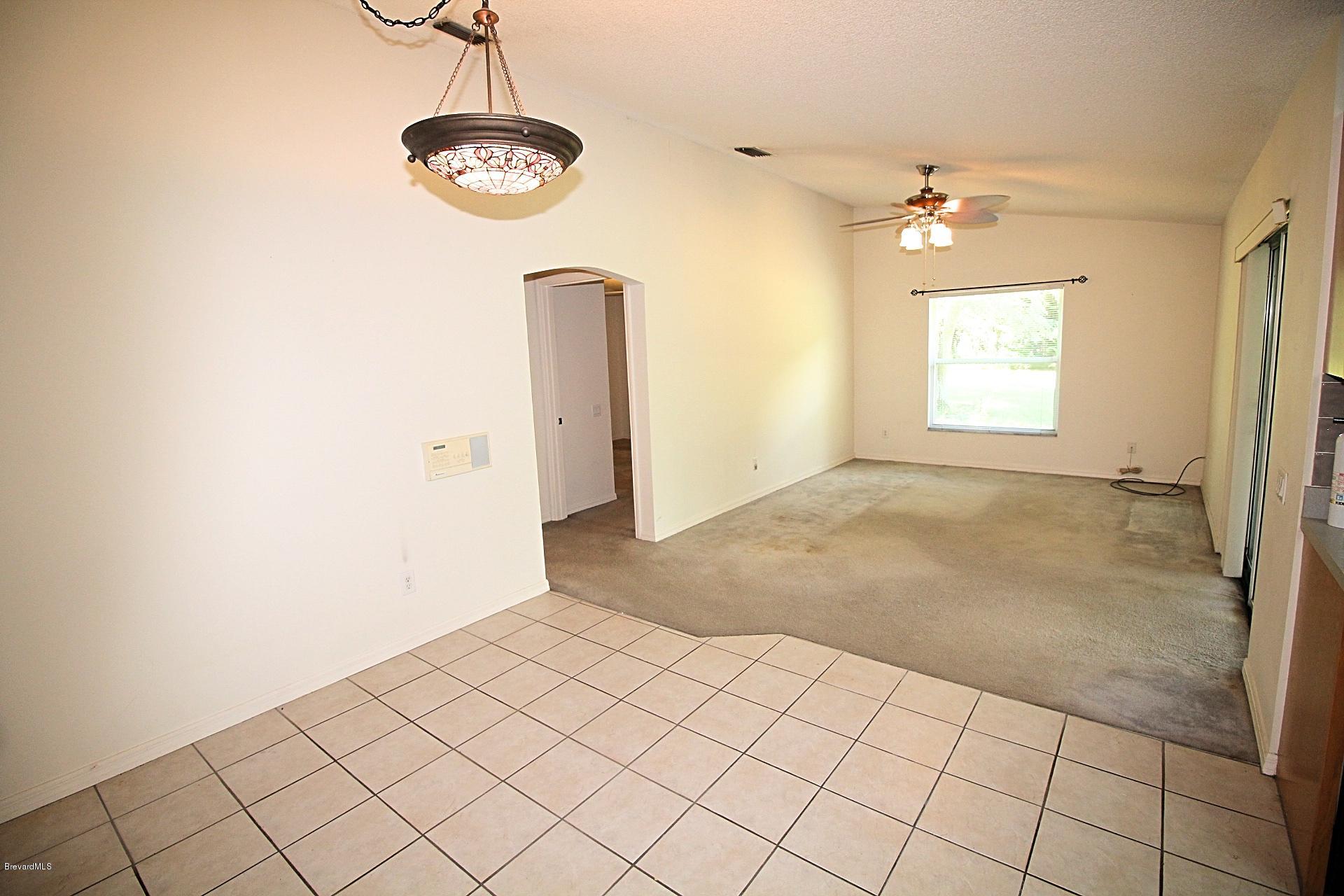724 Riviera Drive Northeast Palm Bay, FL 32905 - Photo 4 of 13 a view of a room with window