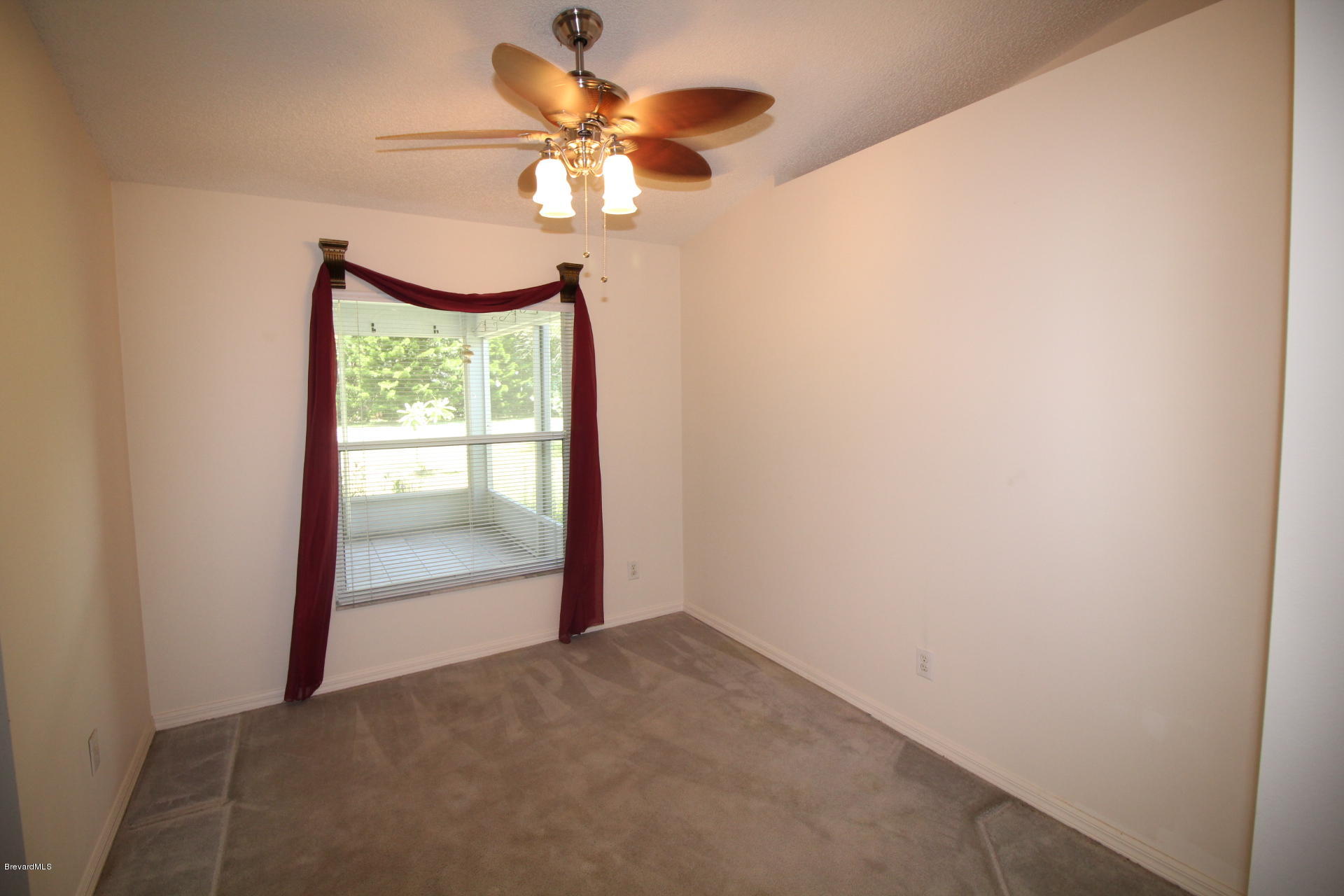 724 Riviera Drive Northeast Palm Bay, FL 32905 - Photo 8 of 13 a view of an empty room