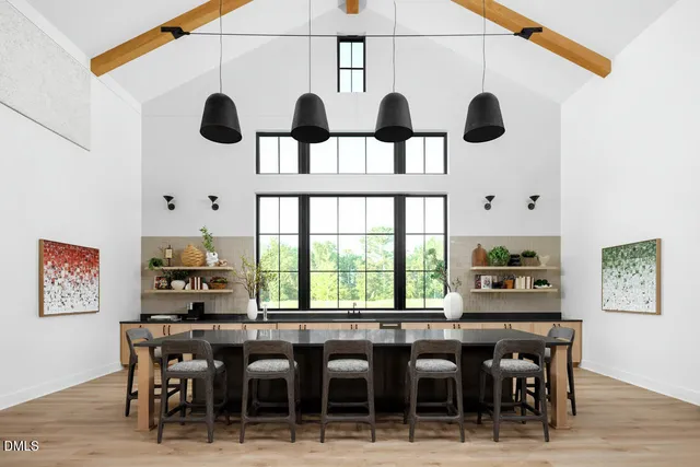 a view of a dining room with furniture and chandelier
