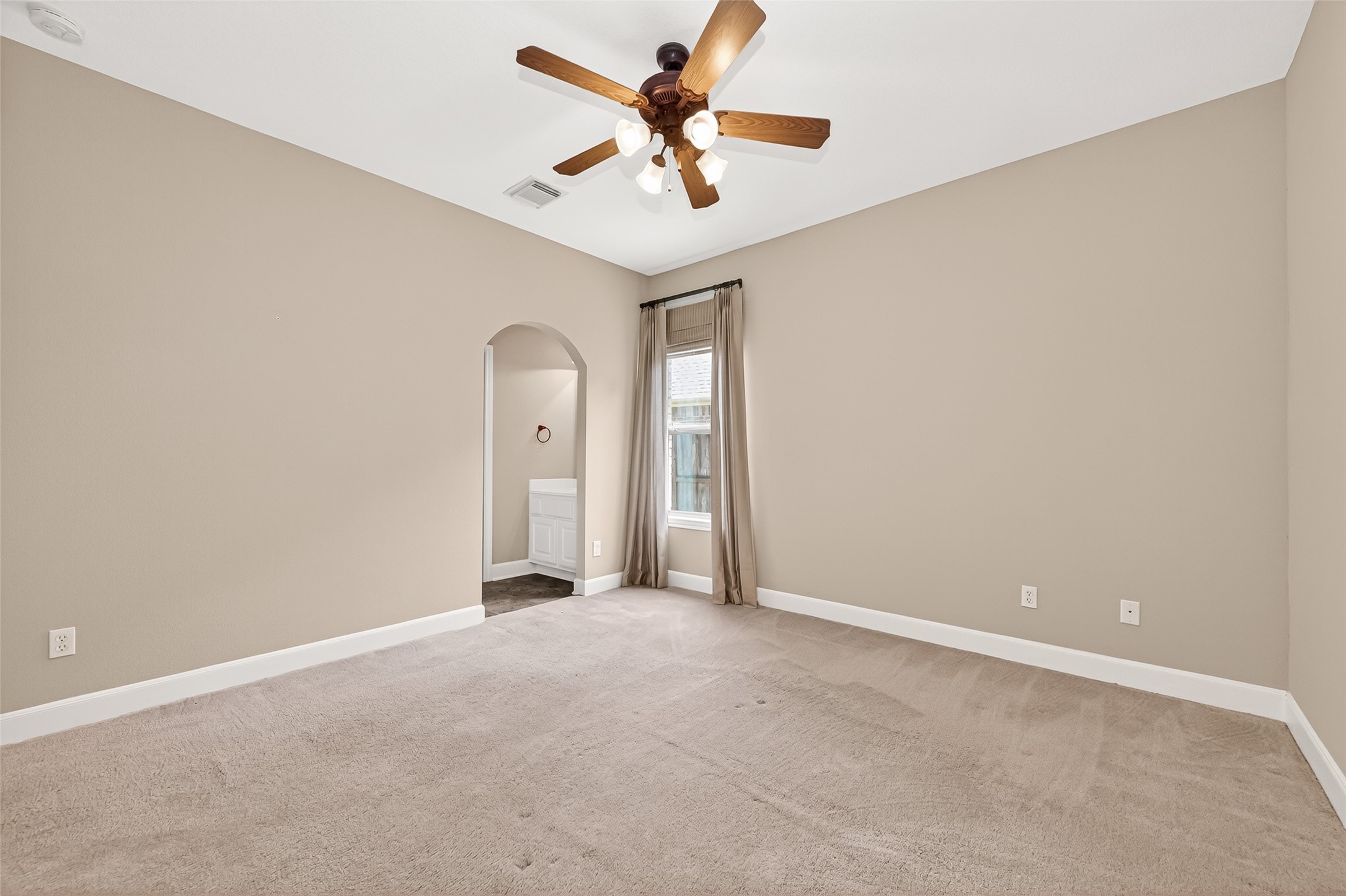 2310 Spring Lake Park Lane Spring, TX 77386 - Photo 31 of 47 an empty room with a window and a fan