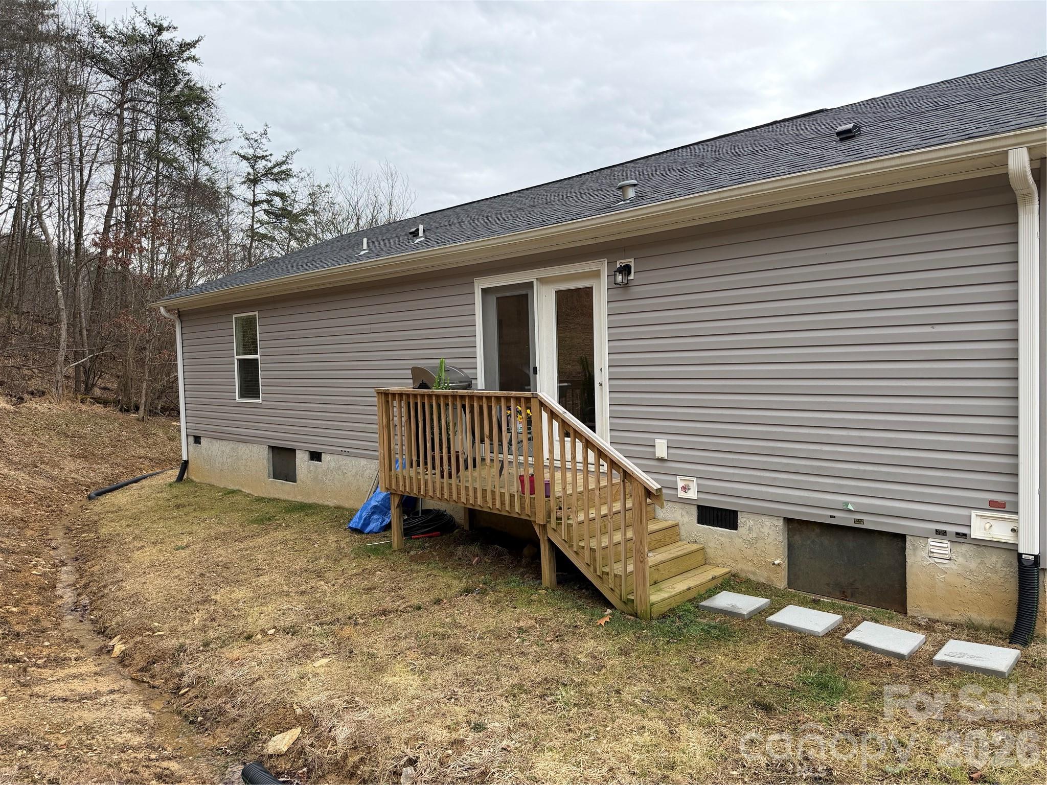 4958 Grapevine Road Marshall, NC 28753 - Photo 11 of 43 a view of a house with a yard