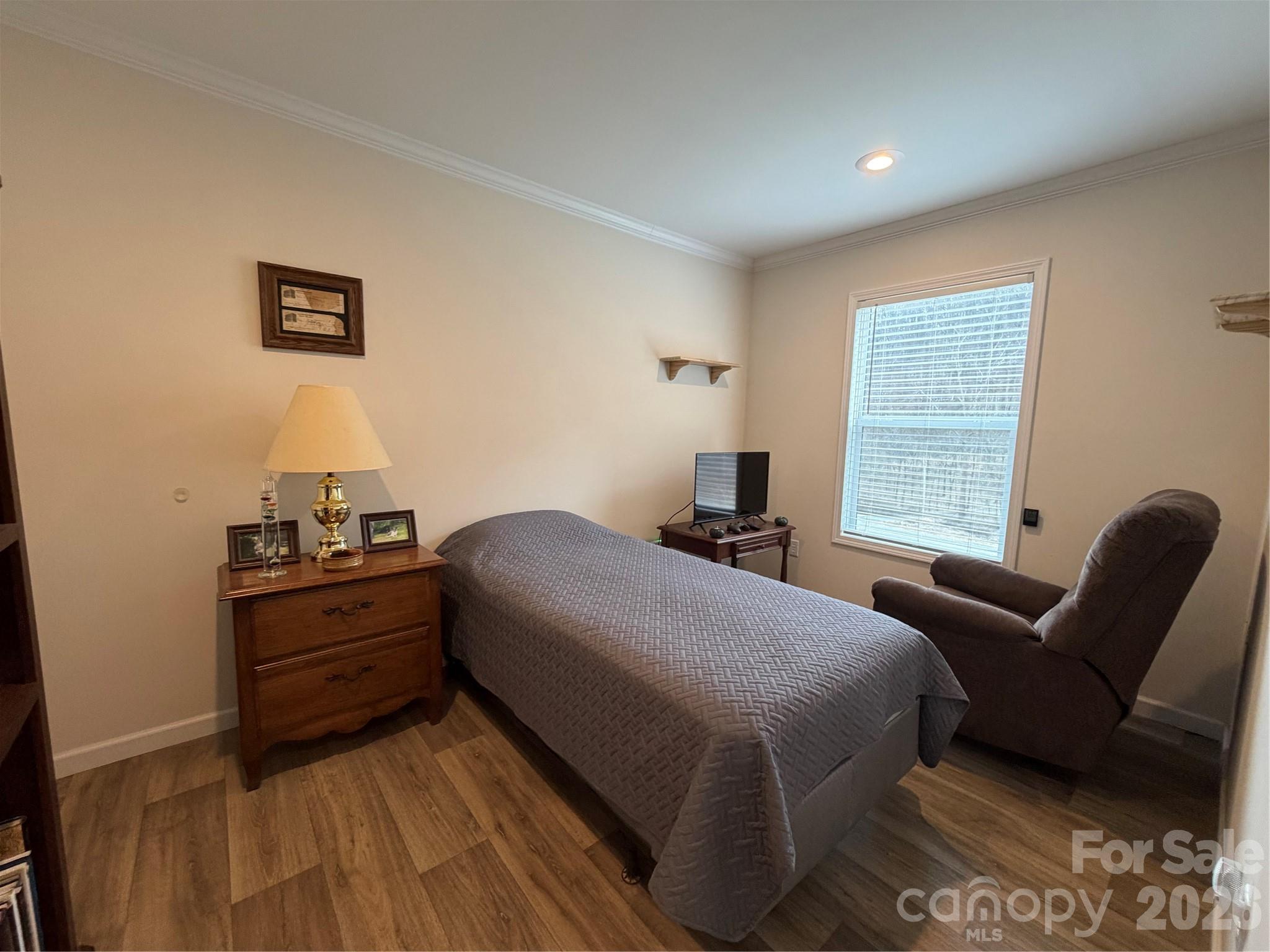 4958 Grapevine Road Marshall, NC 28753 - Photo 40 of 43 a bedroom with a bed and wooden floor