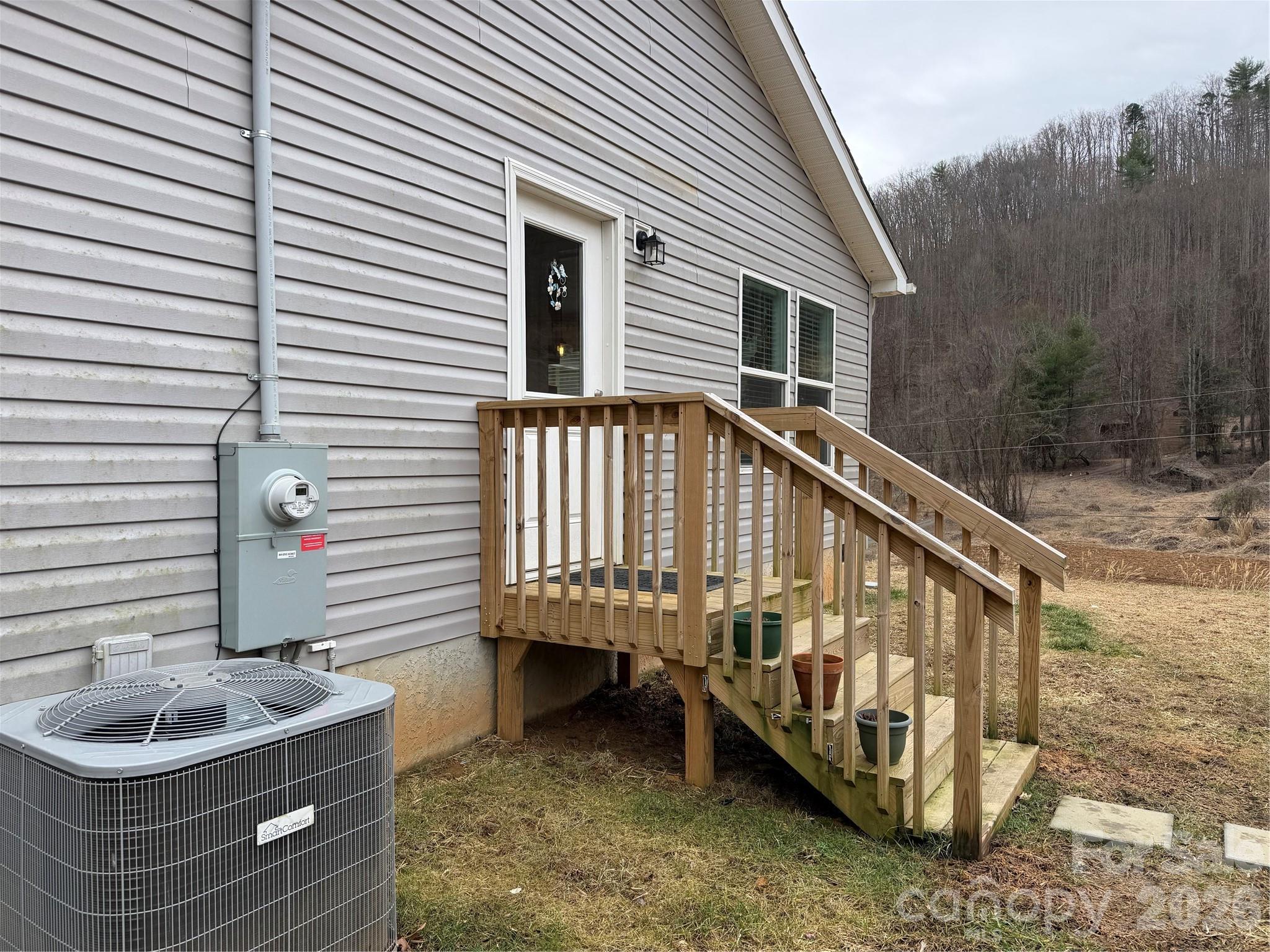 4958 Grapevine Road Marshall, NC 28753 - Photo 10 of 43 a balcony with table and chairs