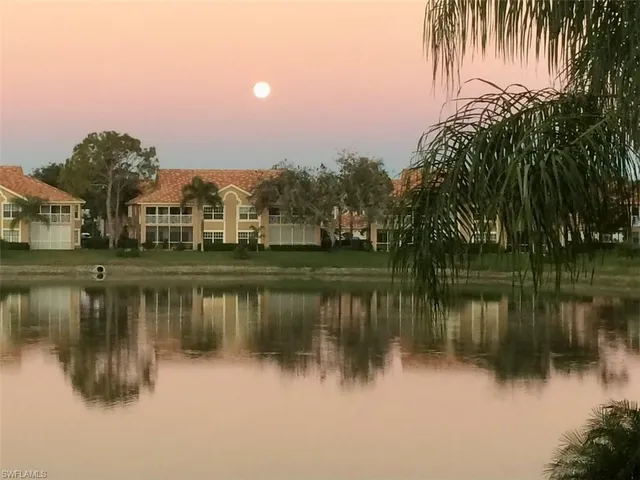a view of a lake with a building in front of it