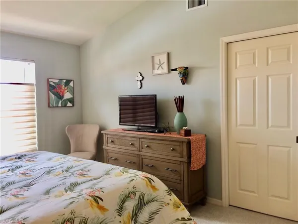 a bedroom with a bed and furniture