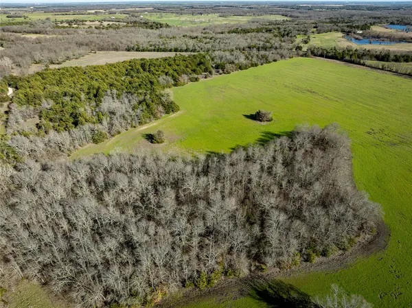 a view of a lake with a yard