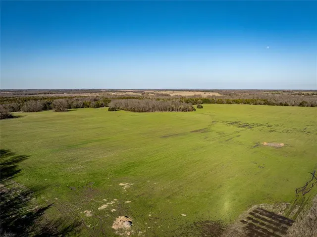 a view of a swimming pool and an outdoor space