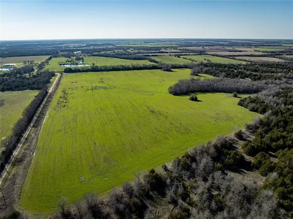 a view of a swimming pool and an outdoor seating