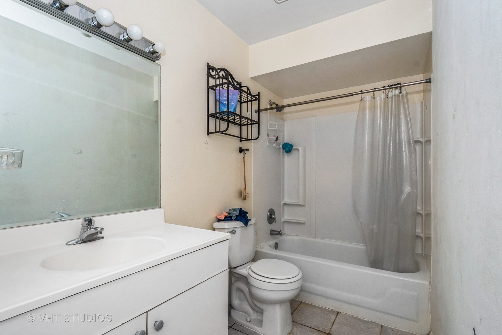 115 East Dundee Road, Unit 1S Wheeling, IL 60090 - Photo 7 of 9 a bathroom with a sink toilet and shower
