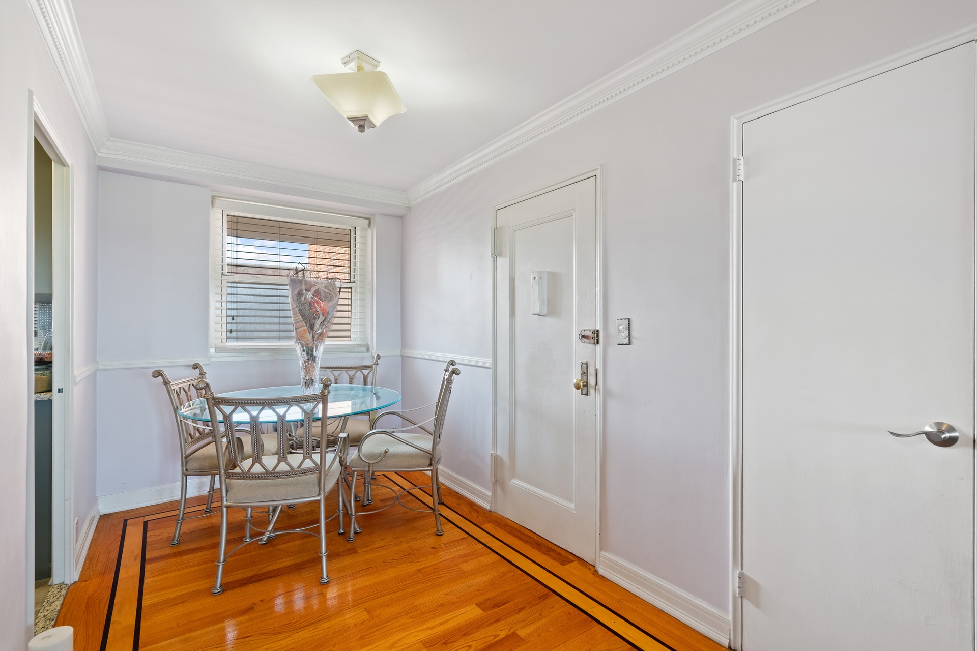 35-31 85th Street, Unit 8L Queens, NY 11372 - Photo 3 of 14 a dining room with furniture and window