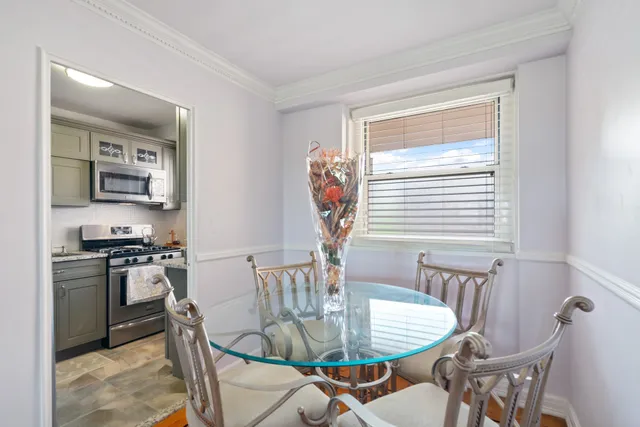 a dining room with furniture and window