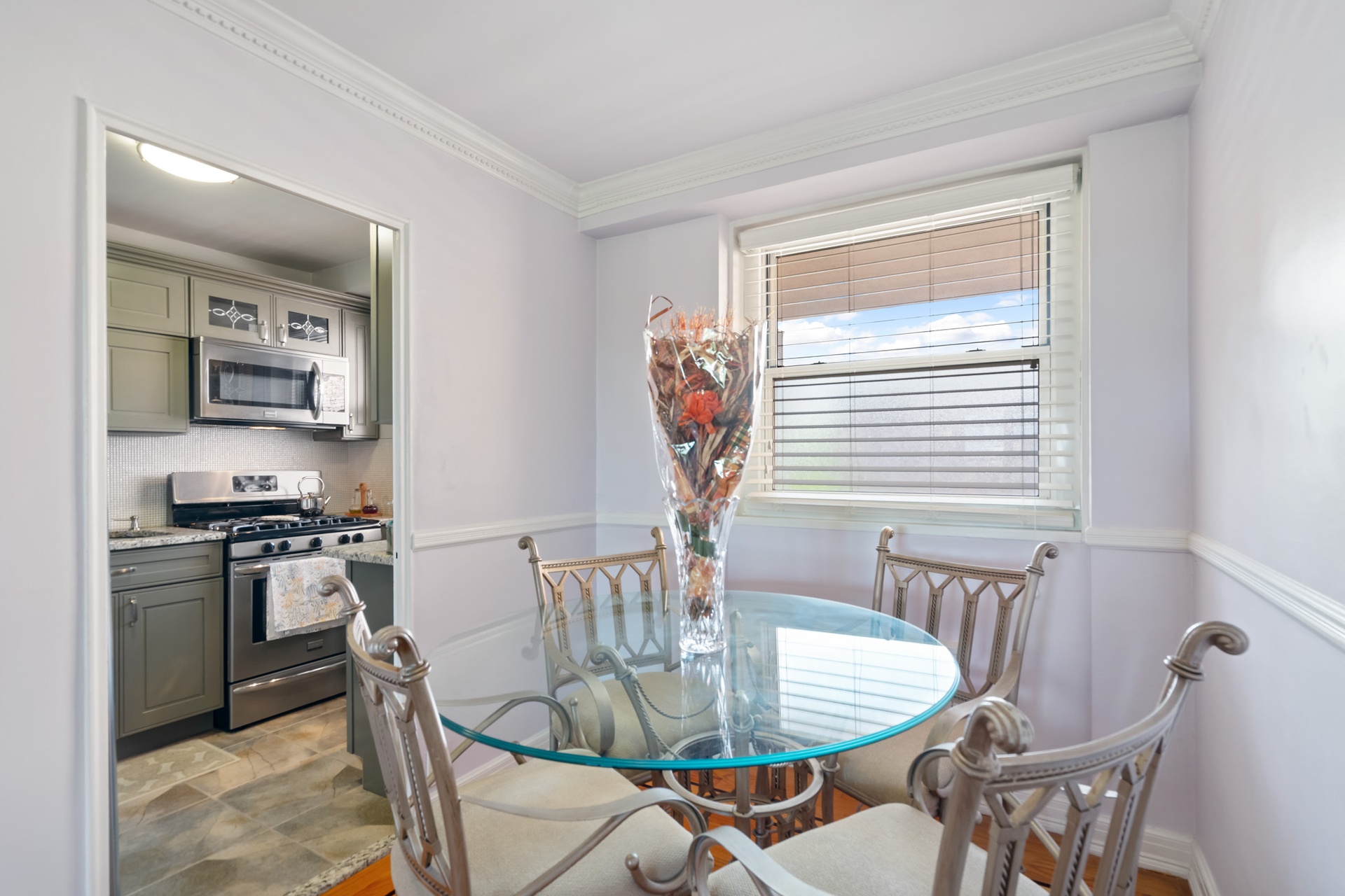 35-31 85th Street, Unit 8L Queens, NY 11372 - Photo 4 of 14 a dining room with furniture and window