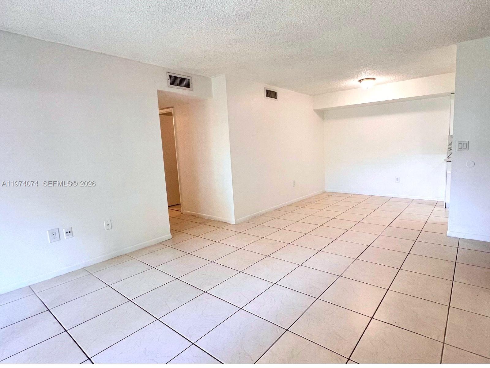 8911 Southwest 123rd Court, Unit 101 Miami, FL 33186 - Photo 3 of 15 a view of an empty room