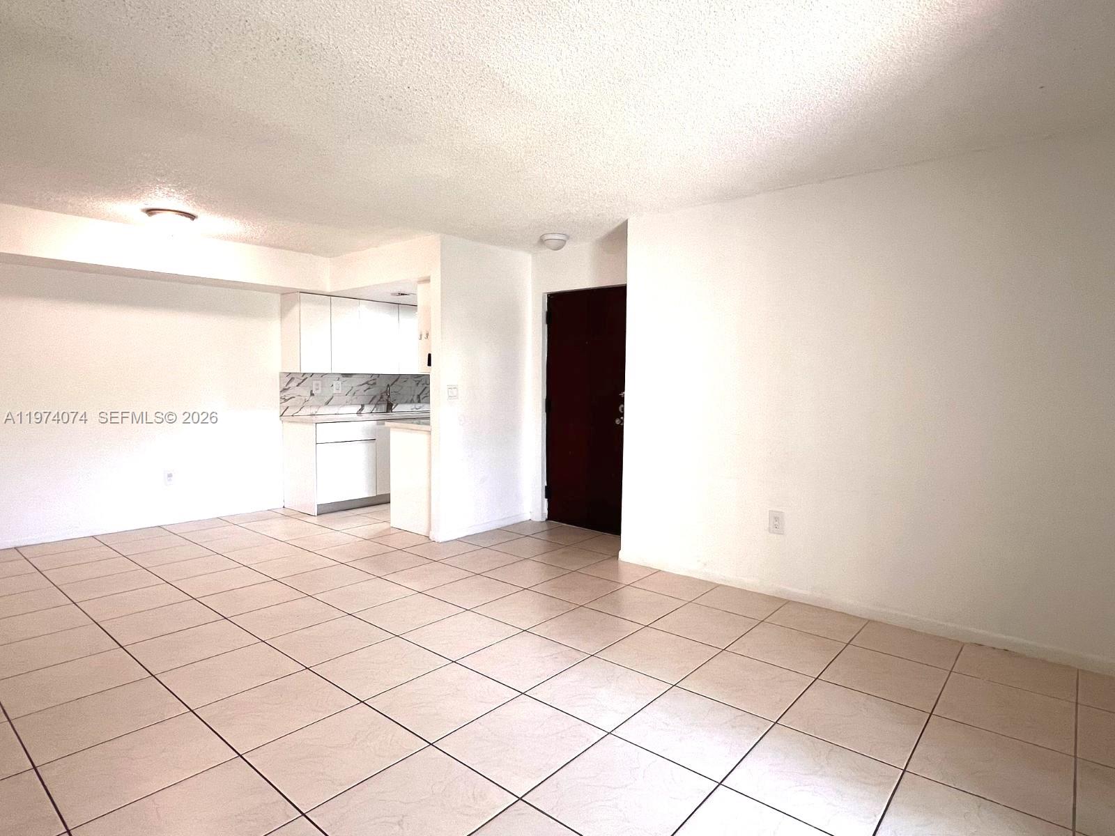 8911 Southwest 123rd Court, Unit 101 Miami, FL 33186 - Photo 8 of 15 a view of a kitchen with a sink