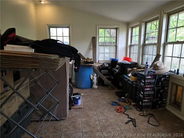 a bed room with a bed and a window