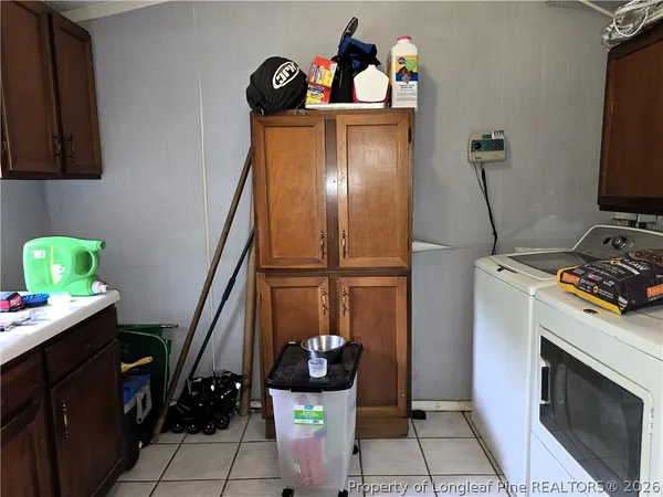 a view of a hallway with workspace and a window