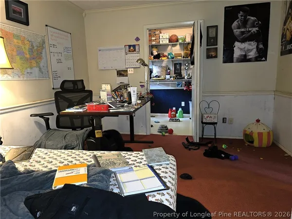 a living room with furniture and a lamp