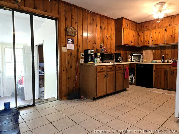 a kitchen with stainless steel appliances granite countertop a refrigerator and a stove