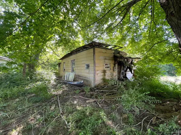 a backyard of a house with lots of green space