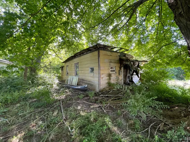 a backyard of a house with lots of green space