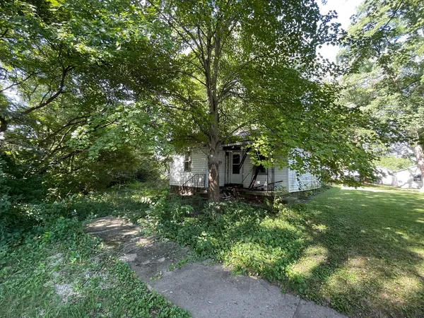 a fire hydrant in the middle of a field