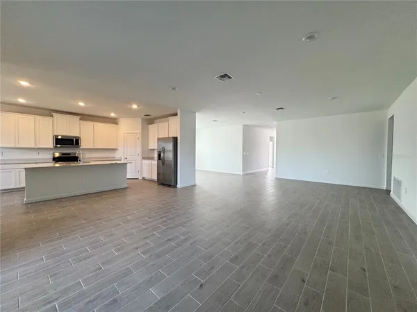 a view of kitchen with wooden floor