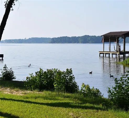 a view of a lake with a big yard