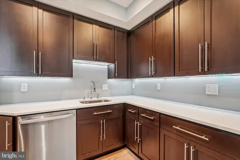 a kitchen with a sink and cabinets