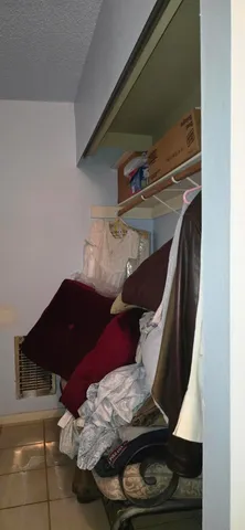 a bedroom with furniture and a mirror