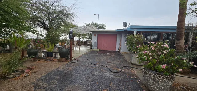 a living room with furniture and a mirror