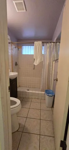 a view of backyard with sitting area