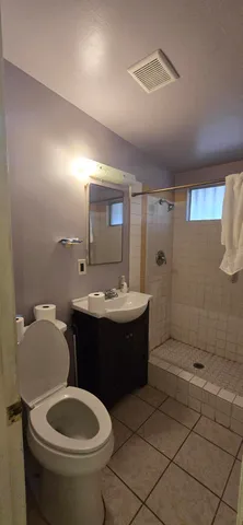 a view of living room kitchen with furniture and fireplace